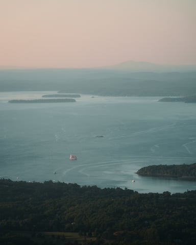 Boat moving across a calm lake